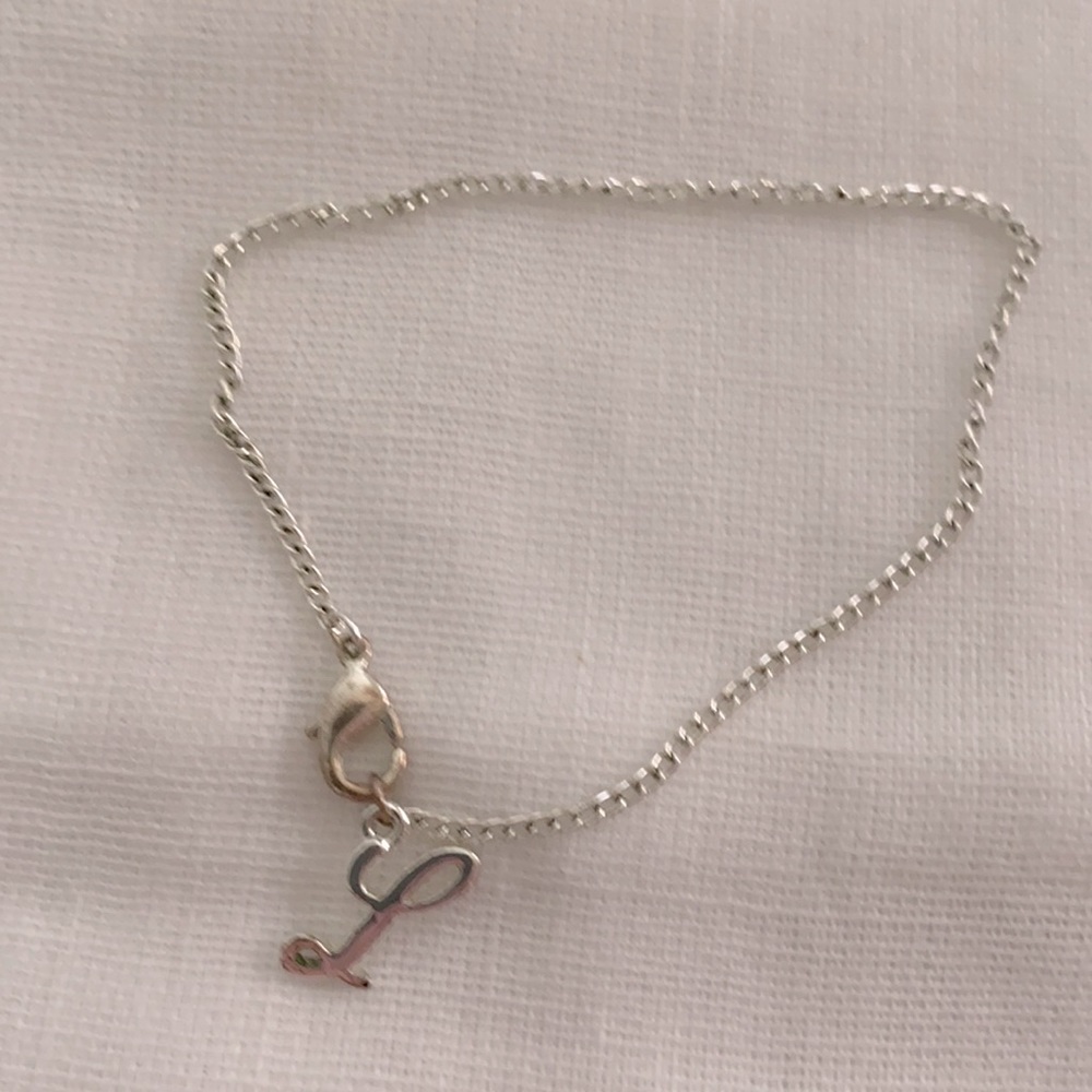 Silver tone L bracelet
